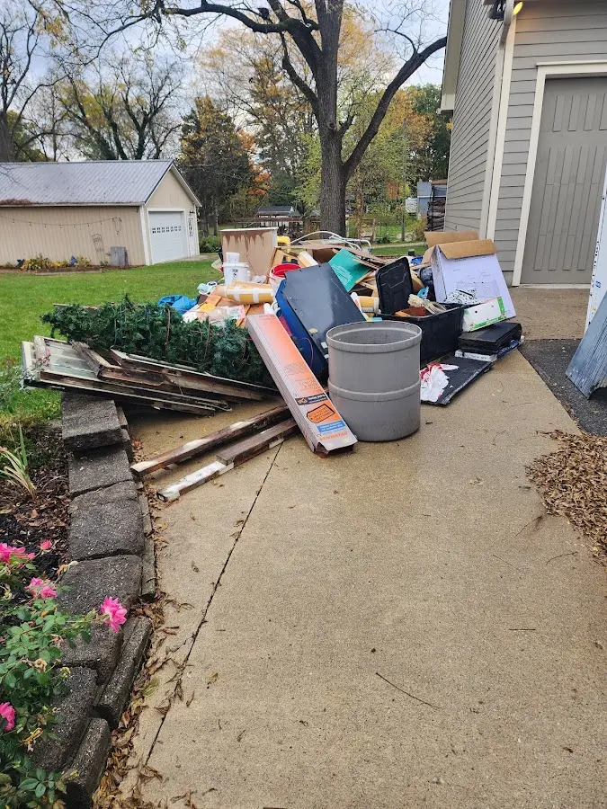 Dumpster being loaded with debris for 30 Yard Dumpster Rental in Berlin